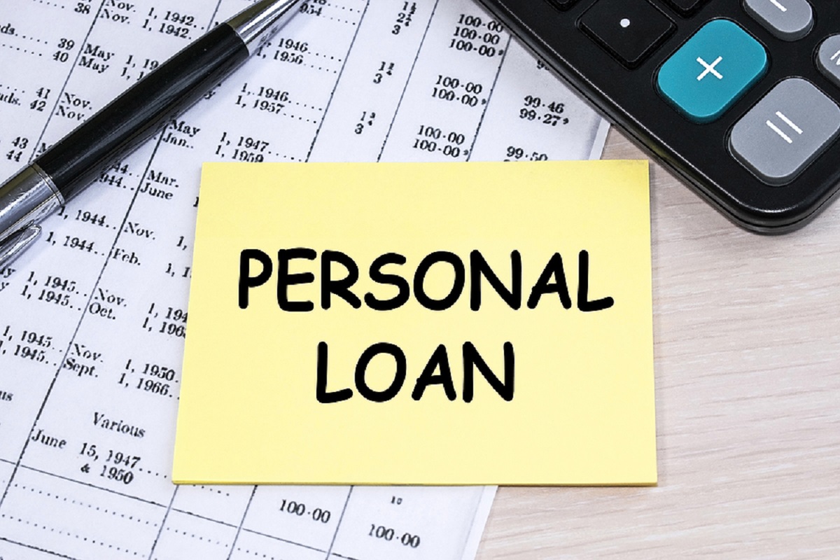 The Inscription Personal Loan On A Yellow Sheet That Lies On The Personal Loan